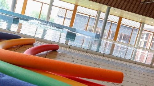 a view of a swimming pool in a building at Unicare Røros in Røros