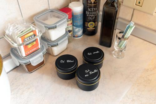 a group of containers sitting on top of a counter at Dolomitihouse ZIRMOL in Fiera di Primiero