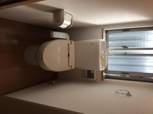 a bathroom with a toilet and a window at Tokai - House - Vacation STAY 11692 in Tokai