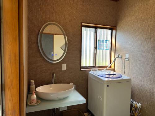 a bathroom with a sink and a mirror at Numazu - House - Vacation STAY 59955v in Numazu