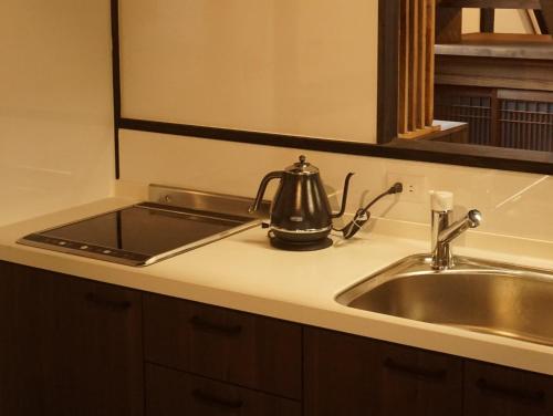 a kitchen sink with a tea kettle on it at Jisaburo Ozawa's residence - Vacation STAY 66110v in Saito