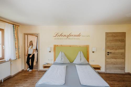 Ένα ή περισσότερα κρεβάτια σε δωμάτιο στο Hotel Grimming dogs&friends