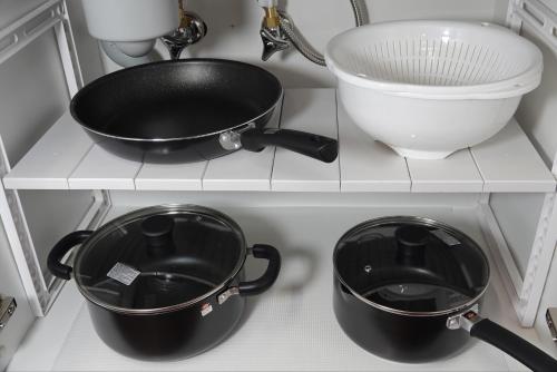 a kitchen shelf with two pots and a sink at THE TORII - Vacation STAY 21195v in Kumamoto