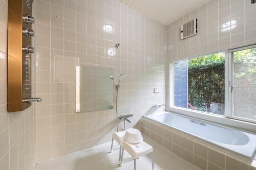 a bathroom with a tub and a window at private villa Kujukuri - Vacation STAY 82023v in Kujukuri
