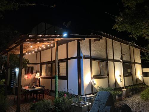 a house with lights on it at night at Fukurou no Oyado - Vacation STAY 71438v in Fuefuki