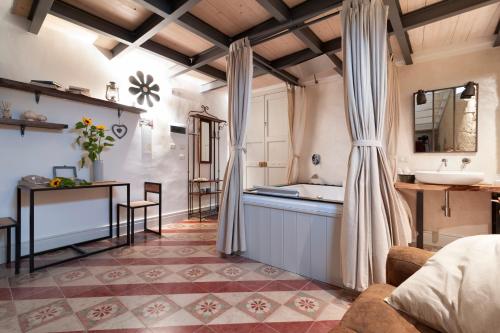 Ένα ή περισσότερα κρεβάτια σε δωμάτιο στο Palazzo Mandurino luxury relais