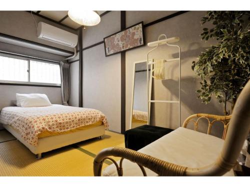 En eller flere senge i et værelse på Konpeitou House - Vacation STAY 11969