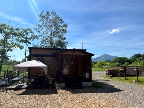 a smallshed with a white umbrella in front of it at niseko kamahale village - Vacation STAY 91397v in Ōmagari