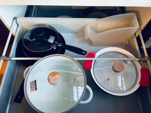a drawer with a mirror and some pots and pans at Palm Villa - Vacation STAY 12202 in Takamatsu