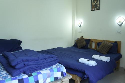 Postel nebo postele na pokoji v ubytování Skyard Hostel & Homestay- Harsil Valley