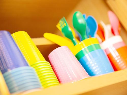 a wooden shelf filled with different colored plastic toys at Tenkyu Inn - Vacation STAY 07349v in Kachabaru