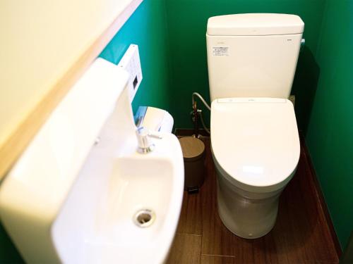 a bathroom with a toilet and a sink at Tenkyu Inn - Vacation STAY 07349v in Kachabaru