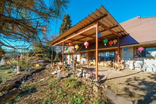 a house with a roof with balloons on it at Fukouji - Vacation STAY 07341v in Numata