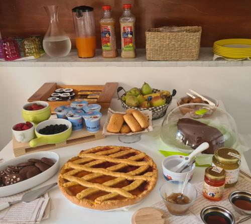 a table with a pie and other food on it at B&B Nonna Iolanda in Camigliatello Silano