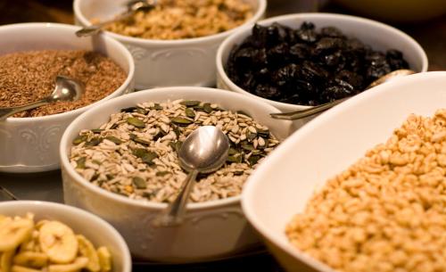 a group of bowls filled with different types of food at Hotel Stubaierhof in Neustift im Stubaital