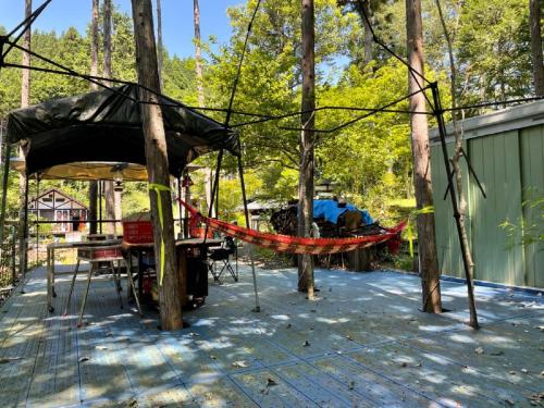 a hammock on a deck in the woods at kohagino - Vacation STAY 12342 in Uenohara
