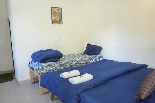 Postel nebo postele na pokoji v ubytování Skyard Hostel & Homestay- Harsil Valley