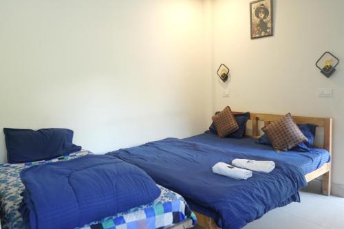 Postel nebo postele na pokoji v ubytování Skyard Hostel & Homestay- Harsil Valley