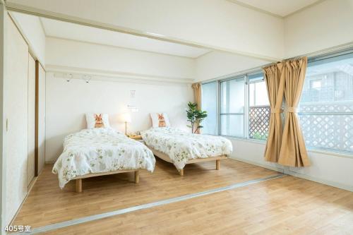 Ένα ή περισσότερα κρεβάτια σε δωμάτιο στο Nanei Building - Vacation STAY 47399v
