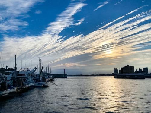 a group of boats docked at a dock in the water at Trawl - Vacation STAY 55770v in Kamakura