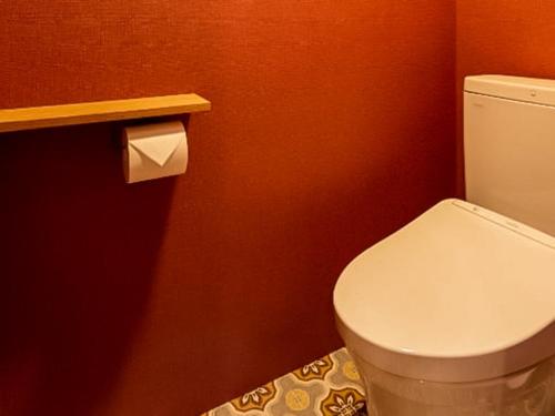 a bathroom with a toilet and a roll of toilet paper at Trawl - Vacation STAY 55770v in Kamakura