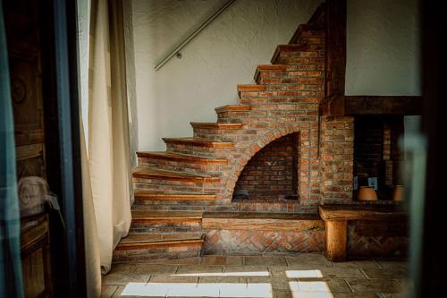 a brick staircase in a living room with a brick at Relais M in Frasnes-lez-Anvaing