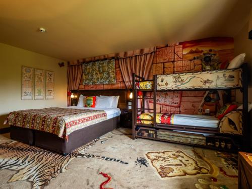 a bedroom with a bed in a room with a wall at LEGOLAND(R) Windsor Resort in Windsor