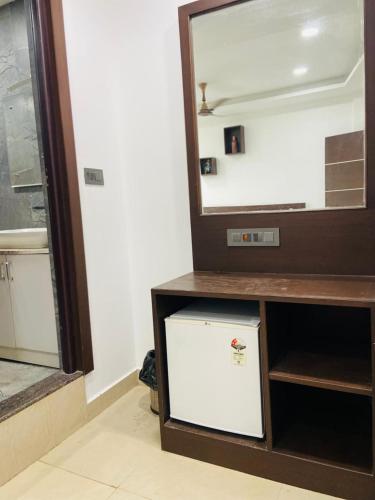 a dresser with a mirror in a room at Cool breeze view Homestay in Madikeri