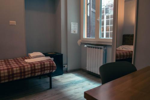 Ένα ή περισσότερα κρεβάτια σε δωμάτιο στο Hotel Big Bang