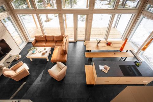 an overhead view of a living room with couches and tables at Stay North - Skadi Lodge in Ylläs