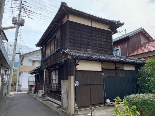 an asian house with a gate in front of it at uminca - Vacation STAY 09850v in Numazu