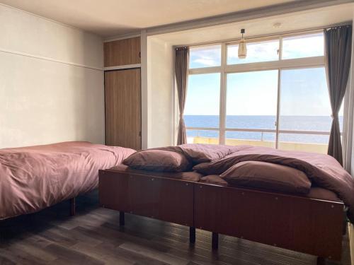 En eller flere senge i et værelse på Trust Maison Kitagawa 303 - Vacation STAY 13430v