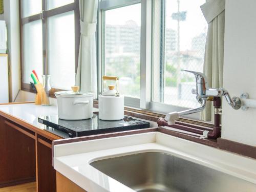 a kitchen counter with a sink and a window at El Sol Town OKINAWA - Vacation STAY 12495 in Chatan