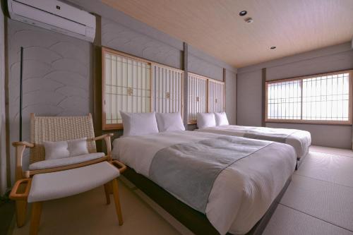 Giường trong phòng chung tại Toki kūkan Izumi - Vacation STAY 13184v