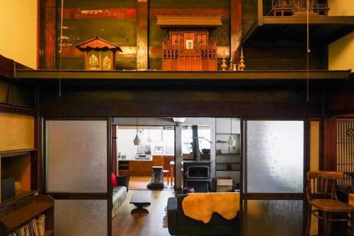a living room with a couch and a kitchen at Arimaya - Vacation STAY 14255v in Mitsumata