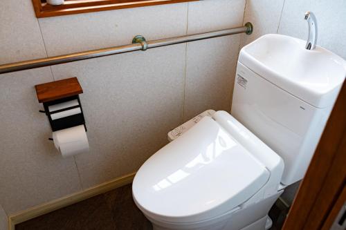 a bathroom with a white toilet and a sink at Tomabari Guest House - Vacation STAY 15604v in Sanuki