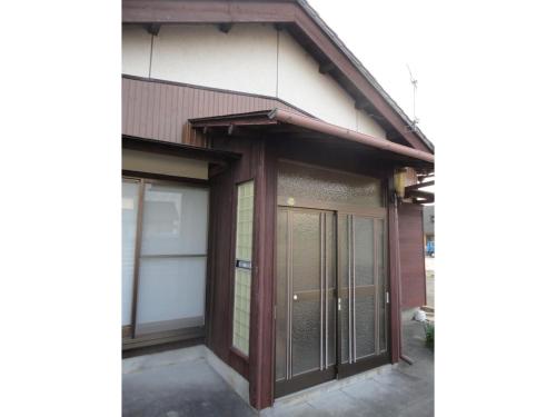 a building with a garage with a door at Ise Myojo no Yado - Vacation STAY 12556 in Saikū