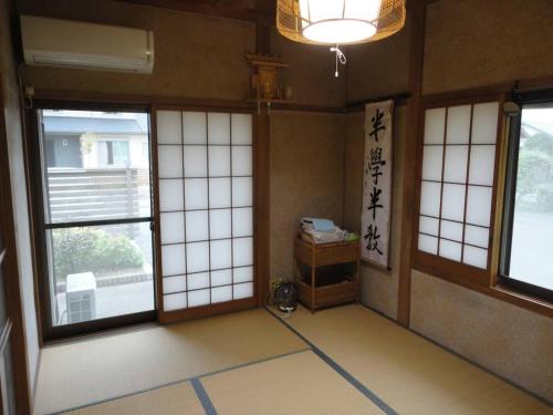 a room with doors and windows in a building at Ise Myojo no Yado - Vacation STAY 12556 in Saikū