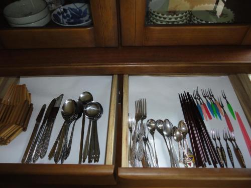 a drawer full of utensils in a cabinet at Ise Myojo no Yado - Vacation STAY 12556 in Saikū