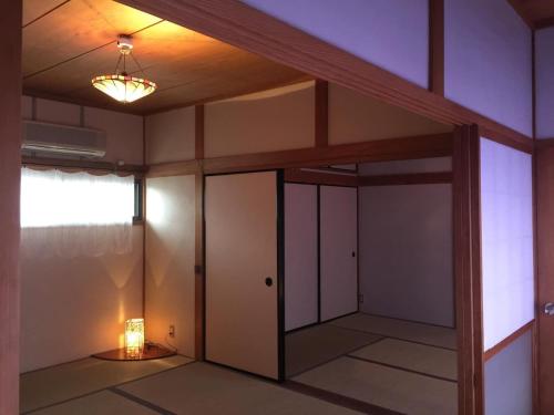 an empty room with a door and a light at Woman Only Ohenro House33 - Vacation STAY 27239v in Kochi