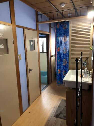 a bathroom with a tub and a sink at Woman Only Ohenro House33 - Vacation STAY 27239v in Kochi