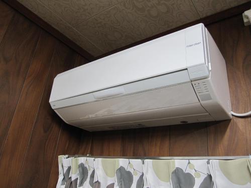 a printer sitting on the floor in a room at GuestHouse AZMO - Vacation STAY 48007v in Matsue