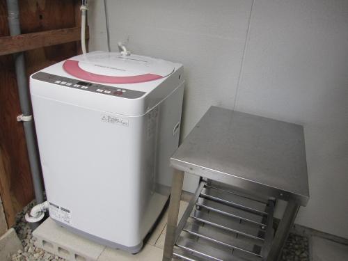 a small refrigerator and a stool in a room at GuestHouse AZMO - Vacation STAY 84356v in Matsue
