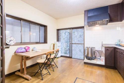 a kitchen with a table and chairs in a room at someya - Vacation STAY 33875v in Kyoto