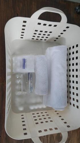 a white basket filled with towels and toilet paper at base sanablend - Vacation STAY 04909v in Kyotango