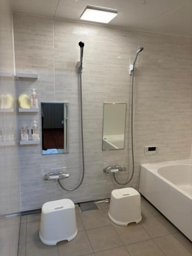 a bathroom with a shower and a toilet and a sink at base sanablend - Vacation STAY 37429v in Kyotango
