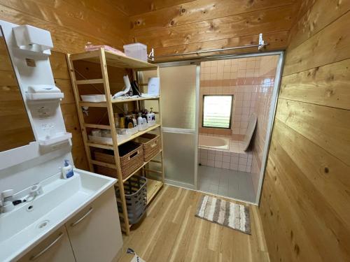 a bathroom with a shower and a toilet and a sink at Coast house Nabura - Vacation STAY 29534v in Nagasaki