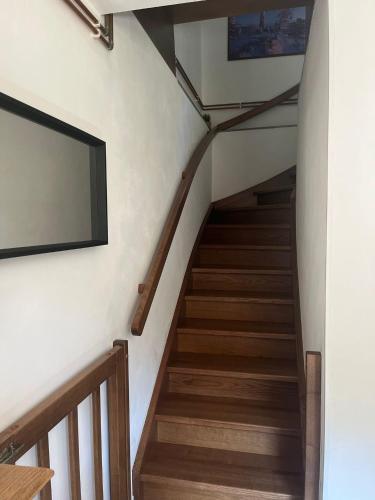 a staircase in a house with a flat screen tv at JIROTOVY BOUDY II in Telnice