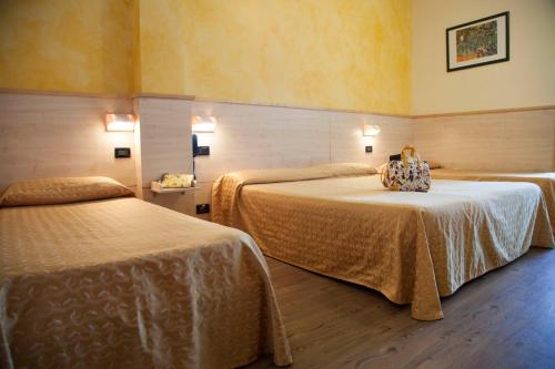 Postel nebo postele na pokoji v ubytování Hotel Mare