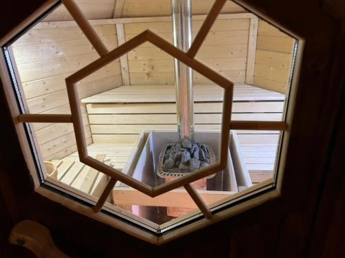 anorthole of a wooden sauna with a window at Jyuuraku no mori - Vacation STAY 50432v in Awara